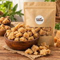 Organic plain jaggery in a wooden bowl with Talwar Organic Foods pouch