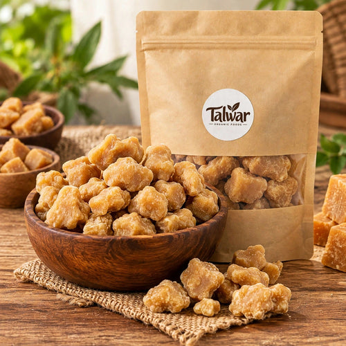 Organic plain jaggery in a wooden bowl with Talwar Organic Foods pouch